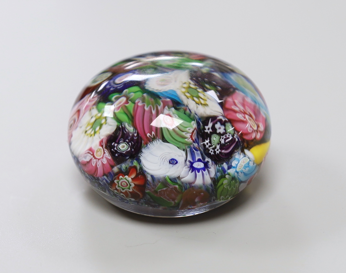 A Clichy scrambled cane paperweight, 5cm diameter